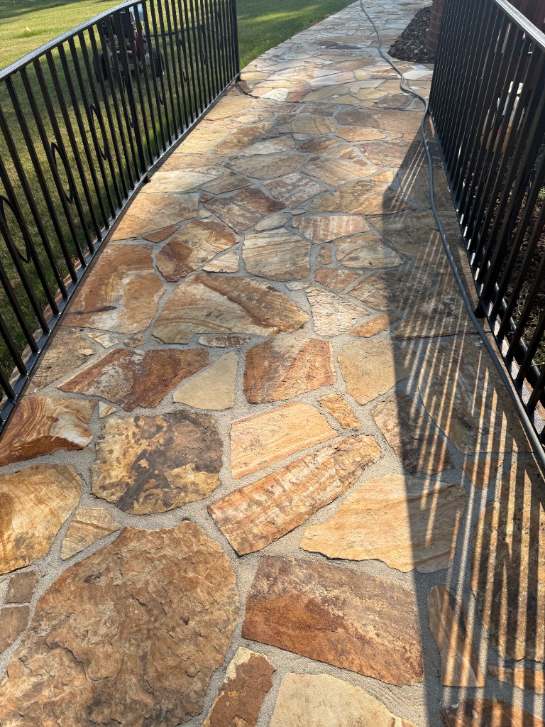 After pressure washing: bright natural flagstone walk with clean joints and even color