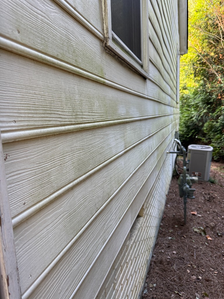 After house siding soft wash: cleaner siding with mildew and streaks removed