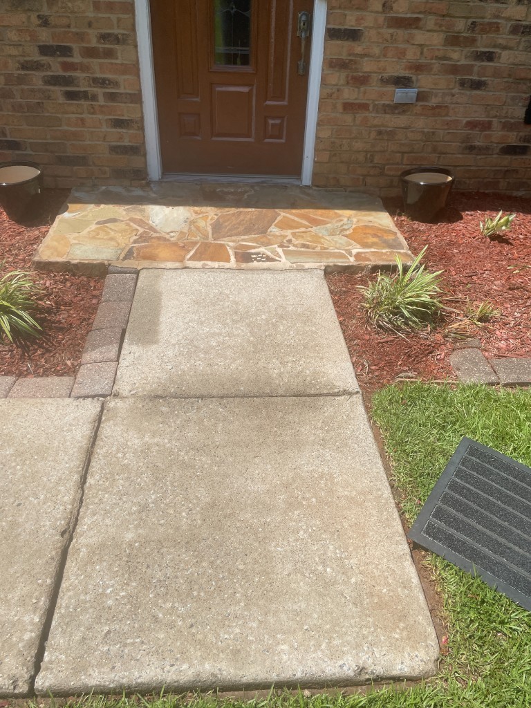After wash: Stone Mountain area — clean concrete walk, stone landing, and entry