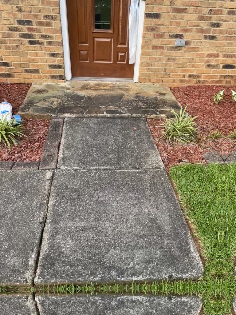 Before wash: same Stone Mountain entryway and hardscape needing cleaning